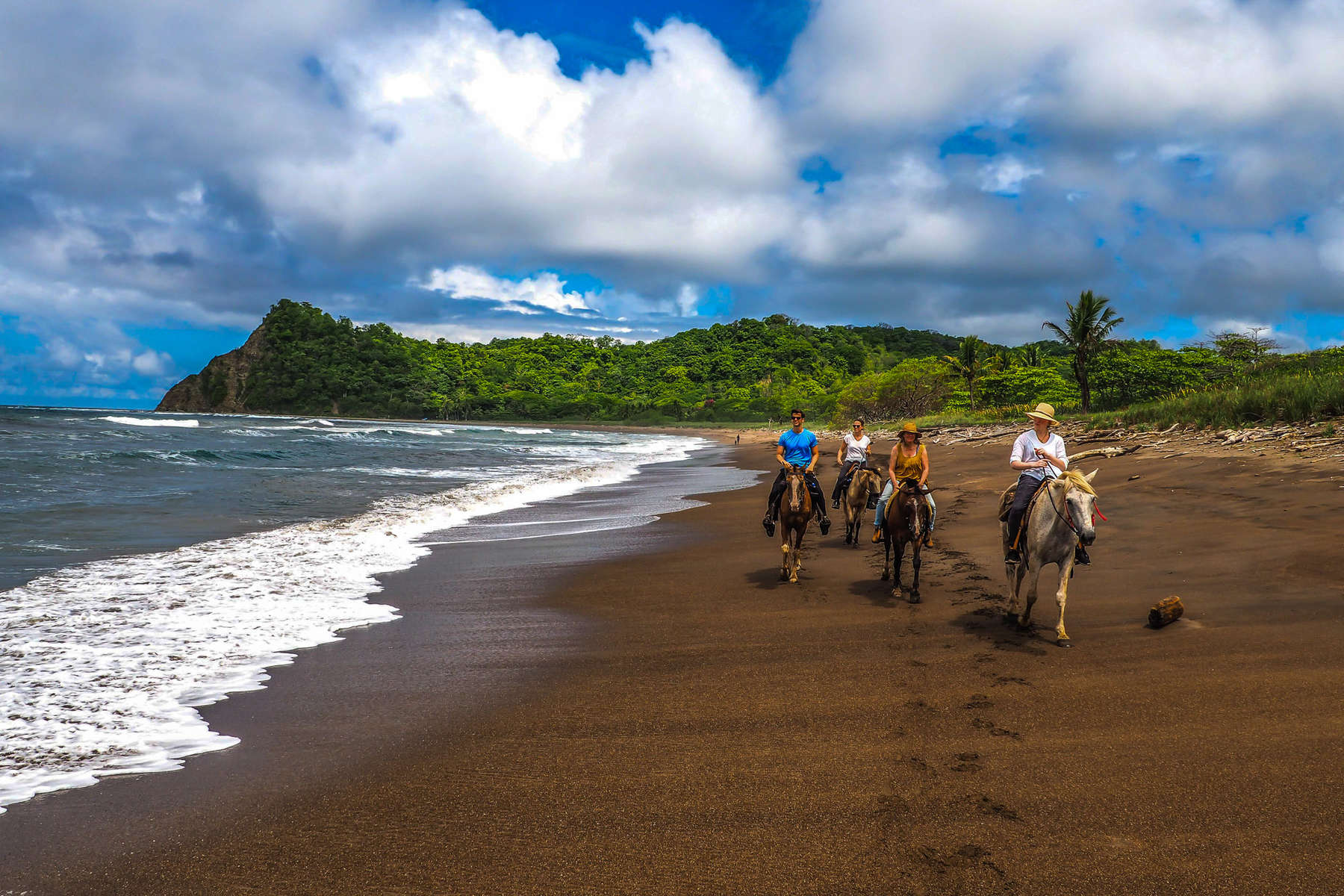 Riders enjoying a beach trail ride in Costa Rica