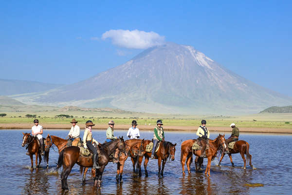 Group of horseback riders on a trail riding holiday in Tanzania