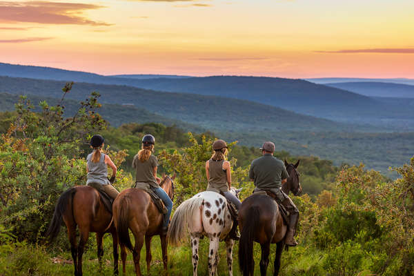 Group of riders admiring the sunset at Ant's Lodges, Waterberg in South Africa