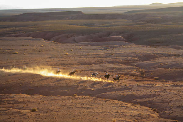 Horseback riders following a trail in the Atlas