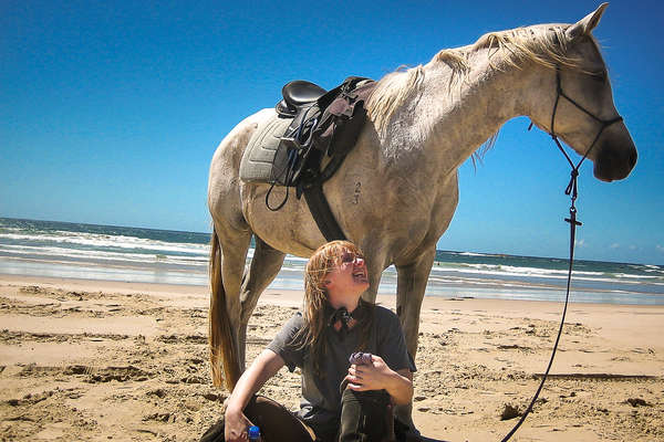 Rider and horse on a beach in Australia