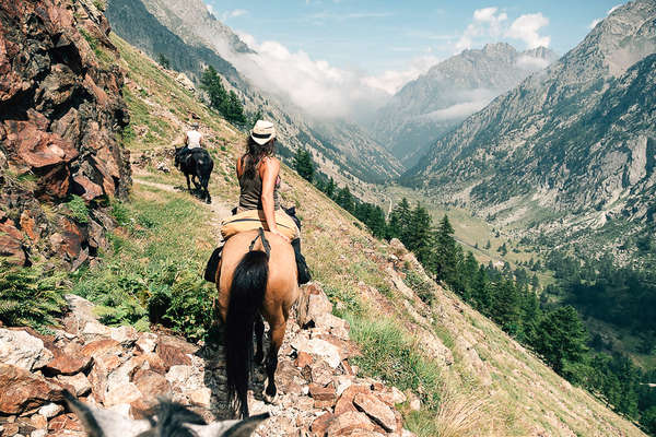 Rider on an adventure horseback trail in the mountains