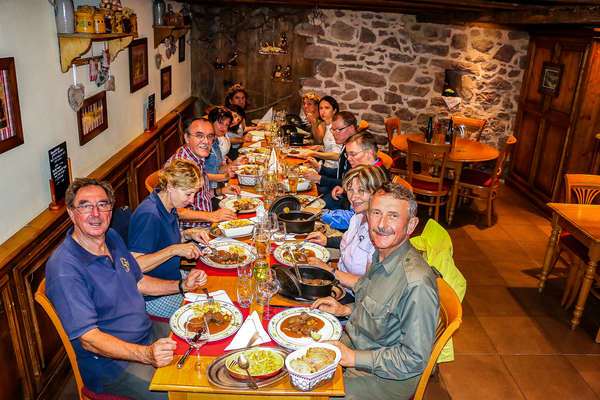 Riders around the dinner table in Alsace on a riding vacation