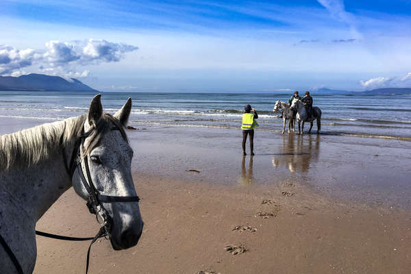 Riders on a beach in Ireland