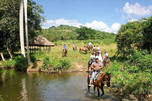 Riding Criollo horses in Cuba