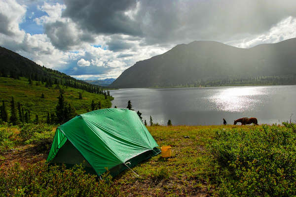 Rustic camping by a lake in the Yukon