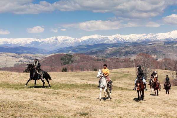 Trail riders against the backdrop of the Bulgarian mountains