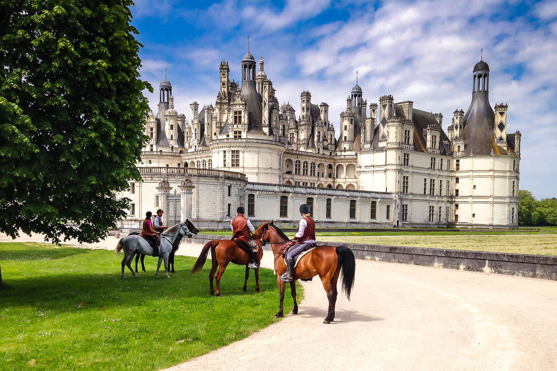 Chambord castle and horseback riders