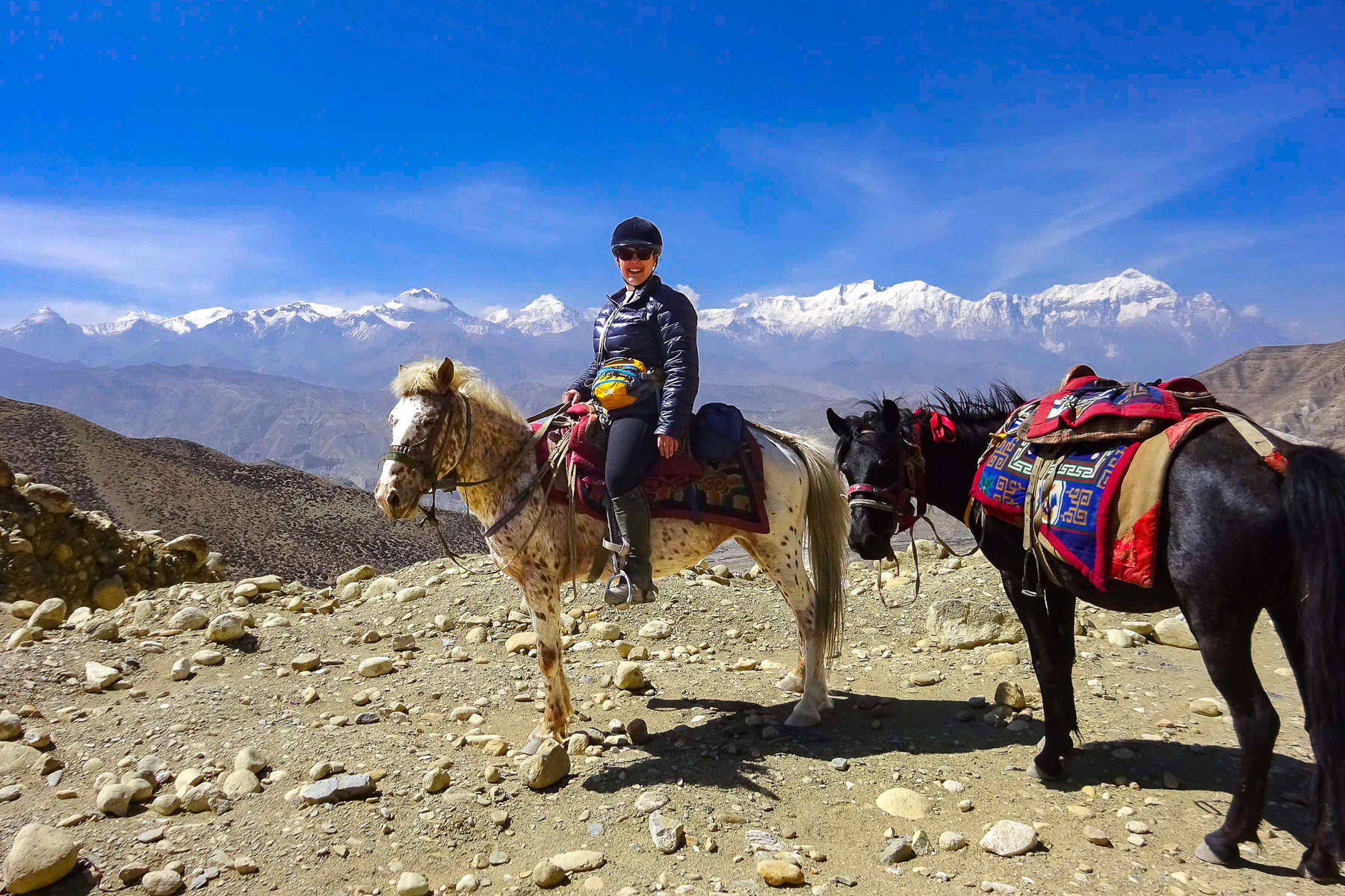 Horseback rider in Nepal, Himalayas trail riding