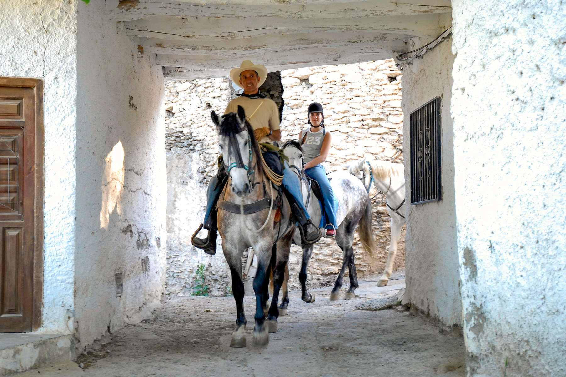 Horseback riders on a trail ride in Spain