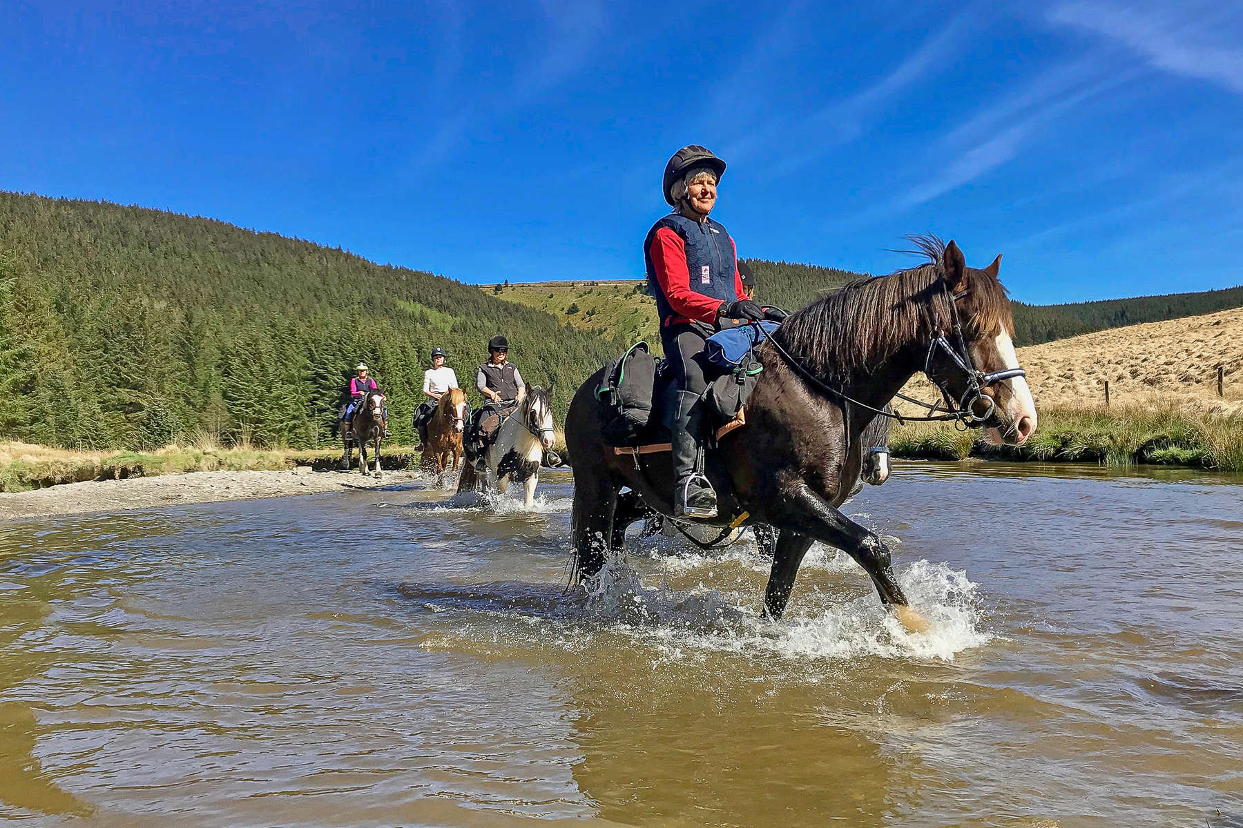 Riders enjoying a trail ride in the UK, Wales