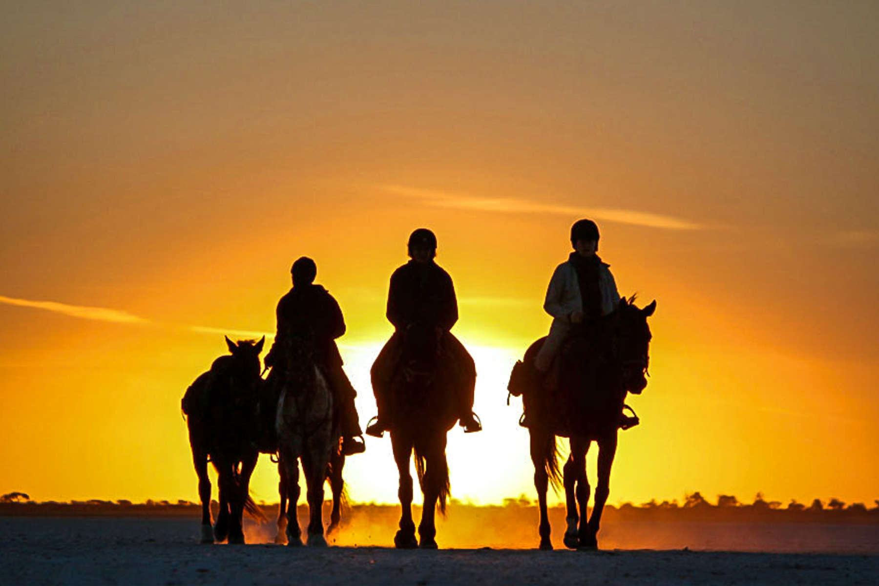 The magical African sunsets, seen from the saddle Sunset in Africa, Kalahari desert