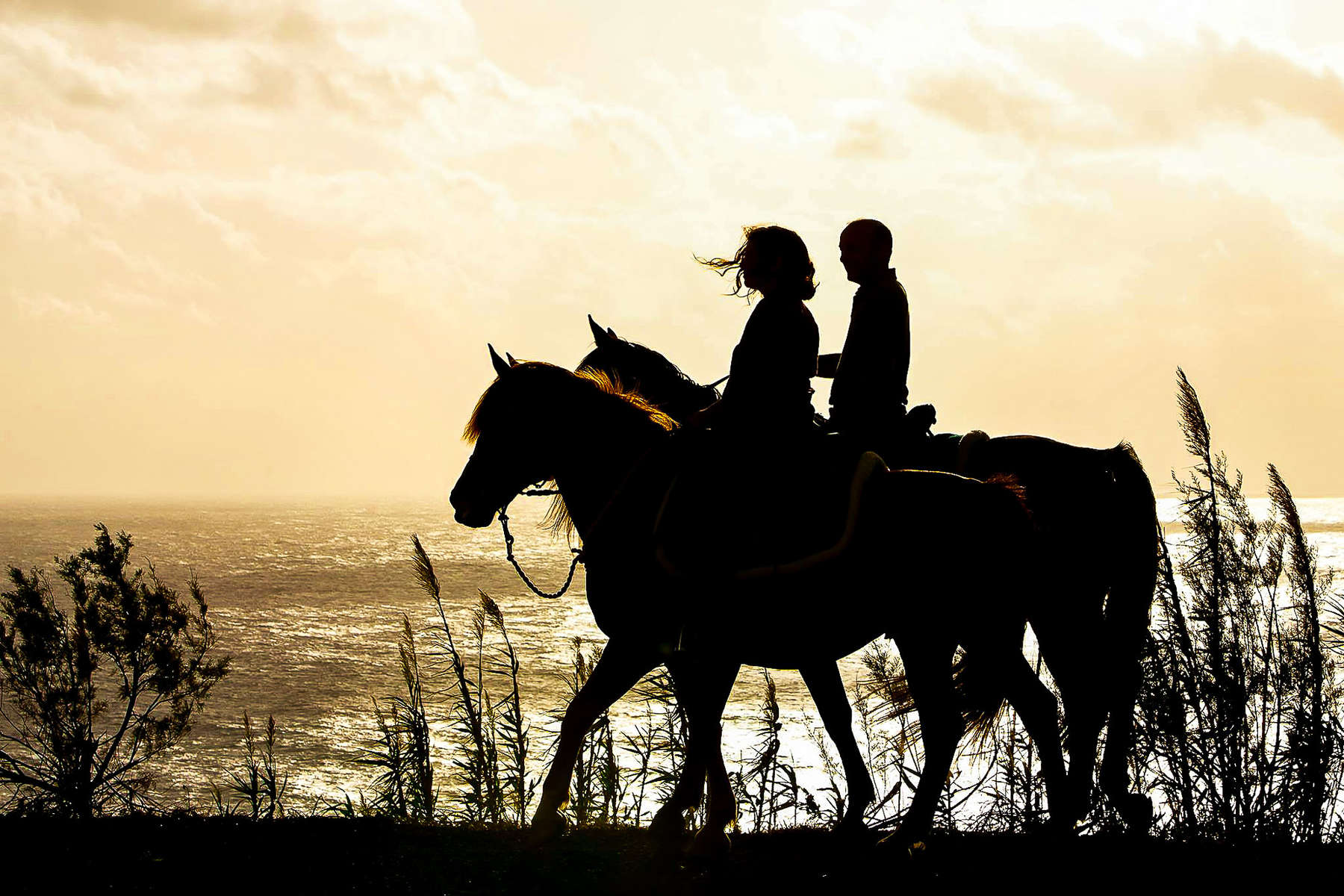 Trail riders as the sun sets on the Azores