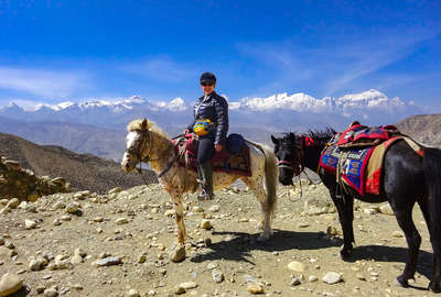 Horseback rider in Nepal, Himalayas trail riding