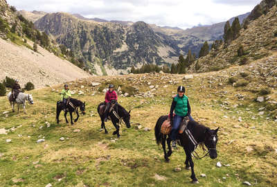 Horseback riders on a pack trip expedition in the Pyrenees