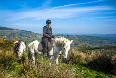 Rider smiling for the camera on a trail riding holiday
