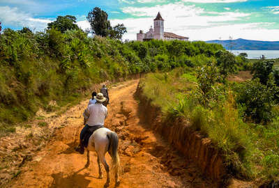 Riders following a trail along the mountain