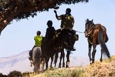 Riders riding in the shade in Morocco