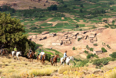 Riders with a background of the valley, Atlas, Morocco