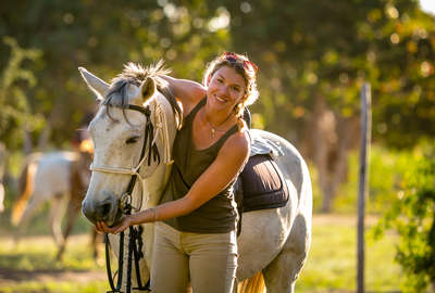 Woman hugging a horse in Mozambique