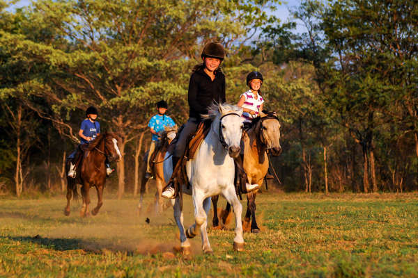 A family riding together in South Africa