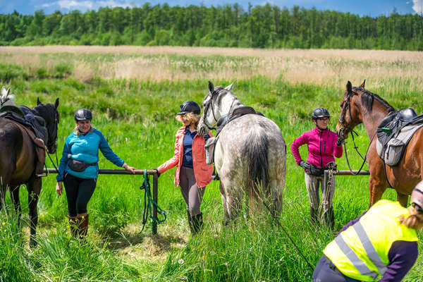 A group of riders taking a break from their riding holiday in Poland