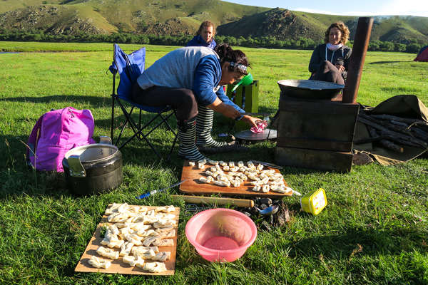 A Mongol cook getting dinner ready on a riding holiday