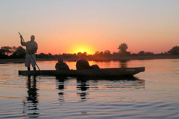 Boat in sunset in Botswana