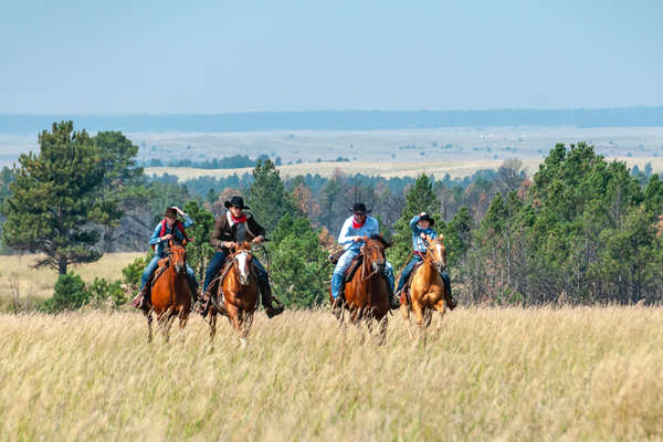 Cowboys racing in Wyoming