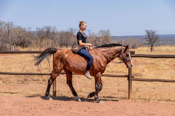 Girl riding a horse in Entabeni