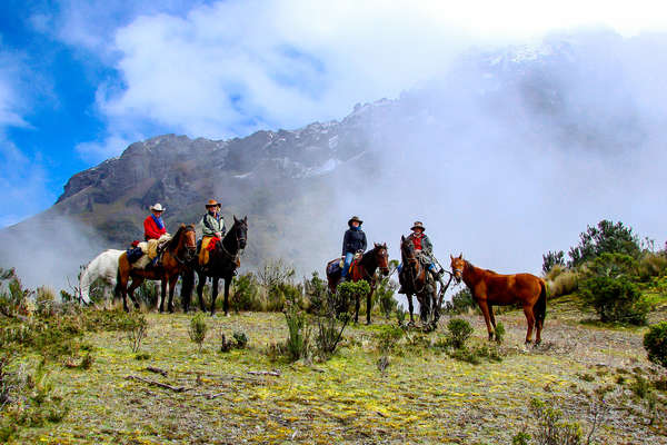 Group of riders about to set out on a riding holiday in Ecuador