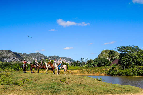 Group of riders admiring the view of the Cuban landscapes