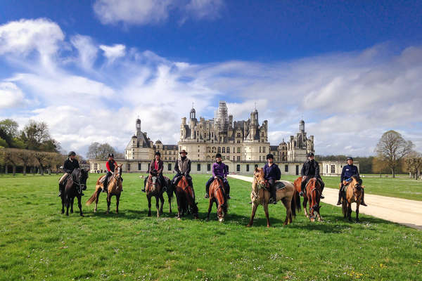 Group of riders on a trail to Chambord castle and the castles of the Loire Valley