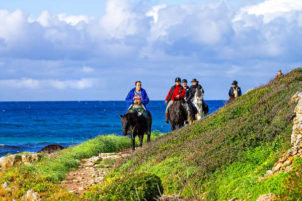 Group of riders on horseback in Menorca