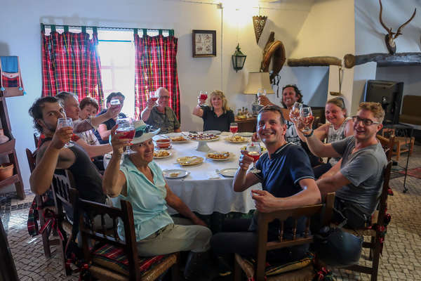 Groups of riders enjoying drinks and dinner during their trail riding holiday in Portugal