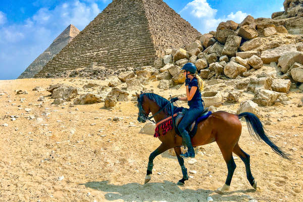 Horse and rider near Cairo, the Great Pyramid of Giza