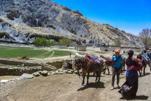 Horse, rider and guide in Mustang, Nepal