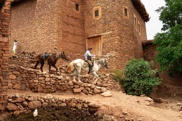 Horseback rider in a village in Morocco