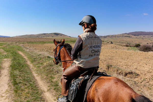 Horseback rider walking along a track in Bulgaria