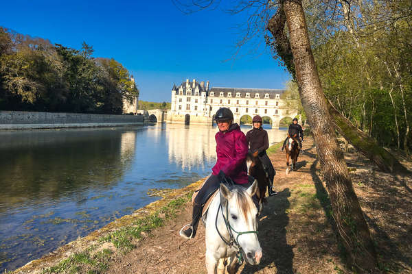 Horseback riders in Chenonceau, Loire Valley renaissance castle