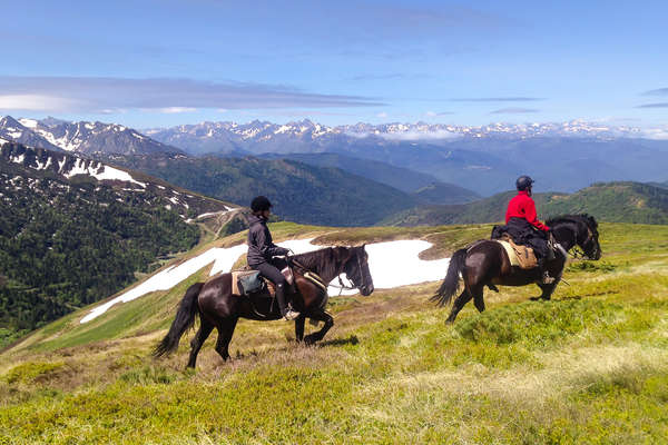 Horseback riders in the French mountains