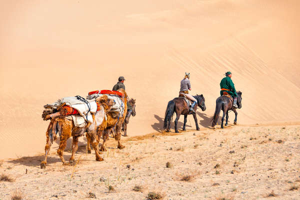 Horseback riders in the Gobi desert in Mongolia