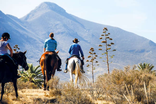 Horseback riders on a multi-day trail ride in Spain