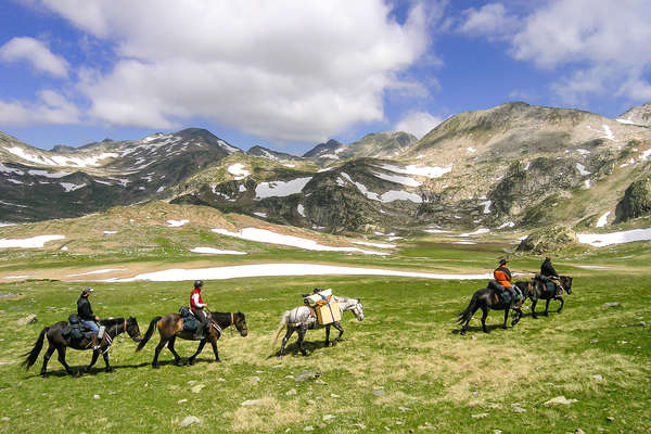 Horseback riders on a trail riding expedition in France