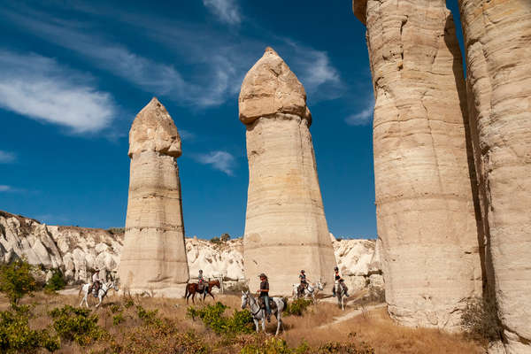 Horseback riders riding in the Love Valley in Cappadocia