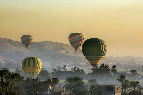Hot air ballons ascending in the sky in Egypt