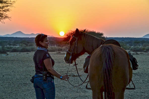 Rider and horse enjoying the African sunset