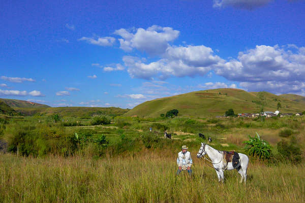 Rider enjoying the view alongside his horse in Madagascar