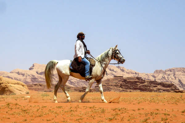 Rider riding along the desert in Jordan