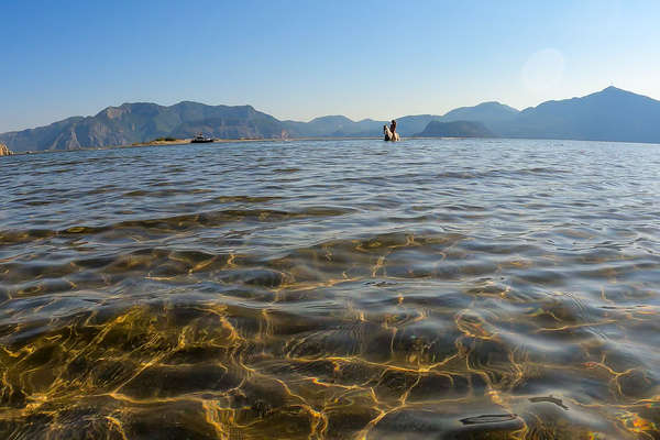 Rider swimming with a horse in Turkey